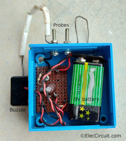 simple water alarm circuit inside its enclosure 