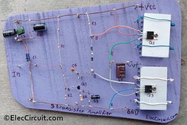 Prototype three transistor amplifier circuits on wooden board