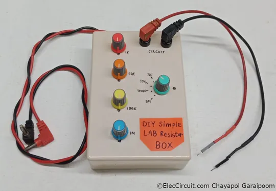 The lab resistance box with resistance range labels, an ohmmeter connector, and breadboard probes.